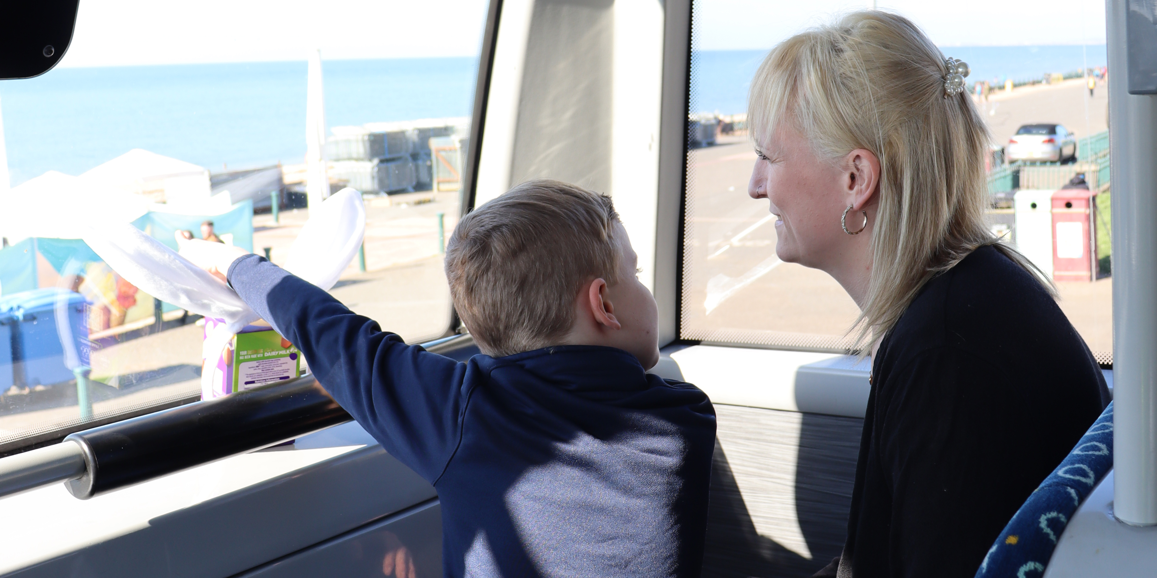 A child and parent on the bus.