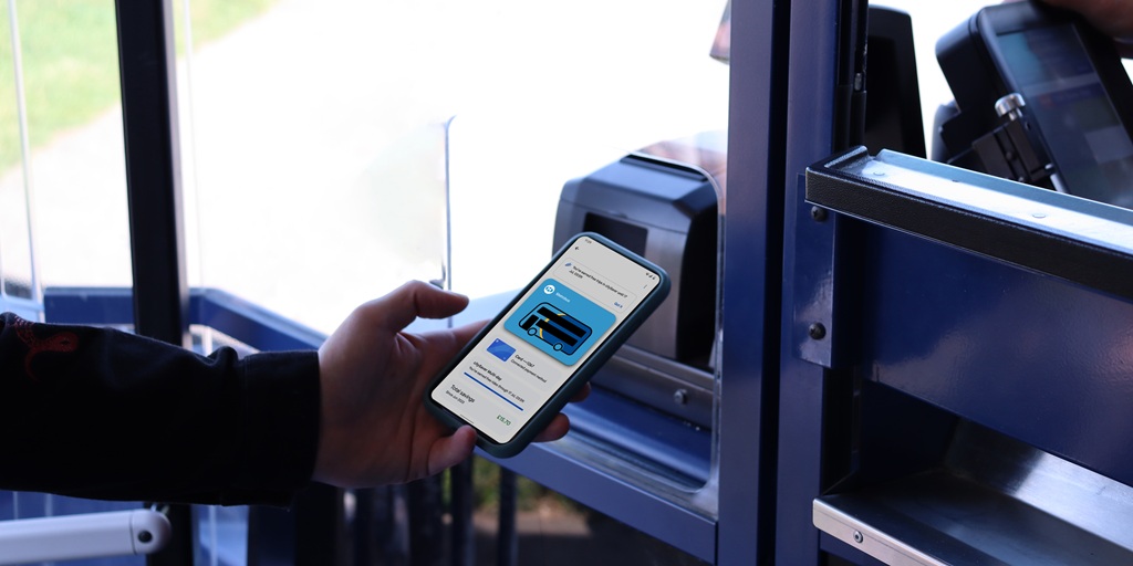 image of person tapping on the bus