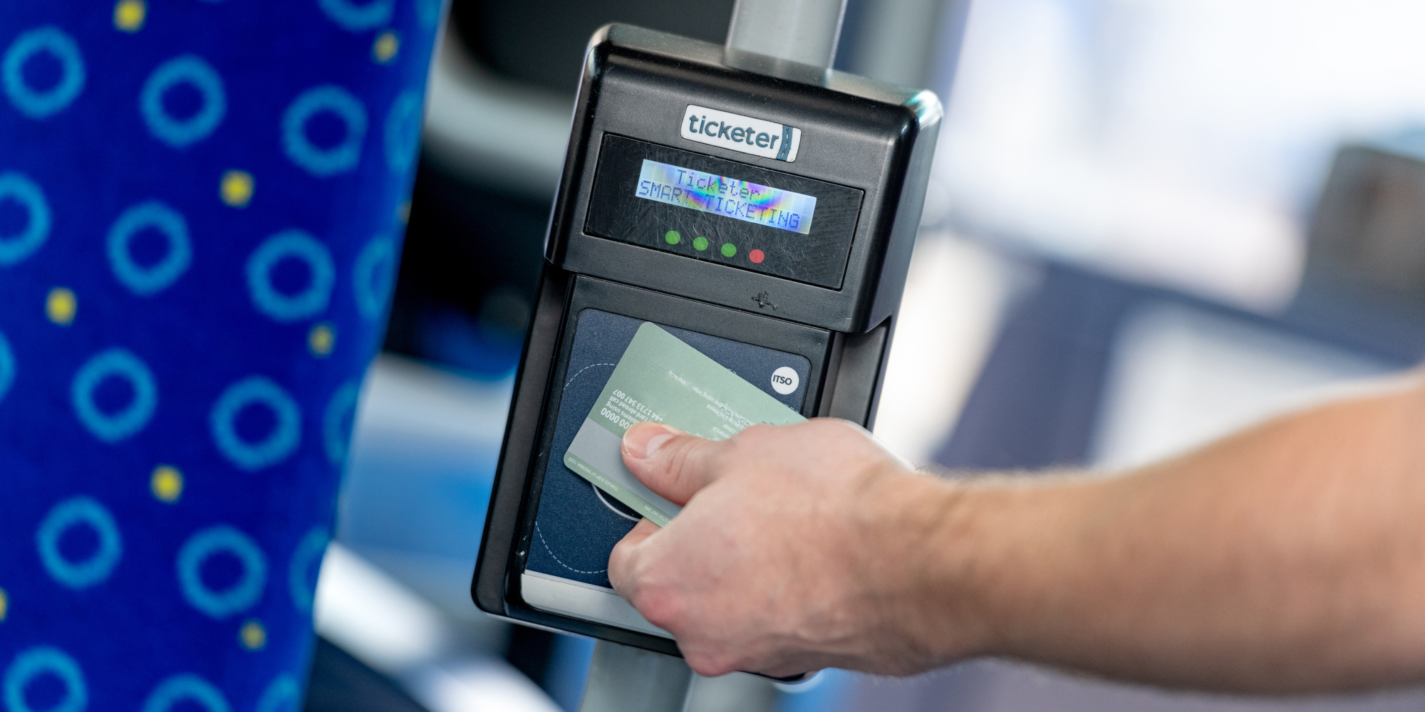 A contactless card tapped on bus