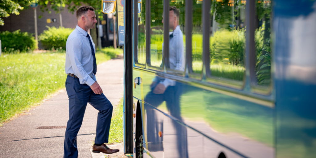 man stepping onto a Metrobus